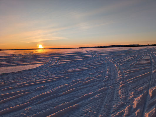 Low sun over a wide expanse of snow