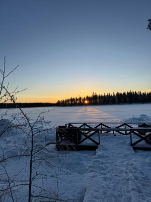 Winter landscape with a snowmobile in the foreground